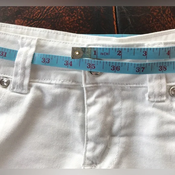 Low rise Shorty shorts - white jean 34” hip/lower waist as it sits lower.   9/10 - Picture 2 of 9
